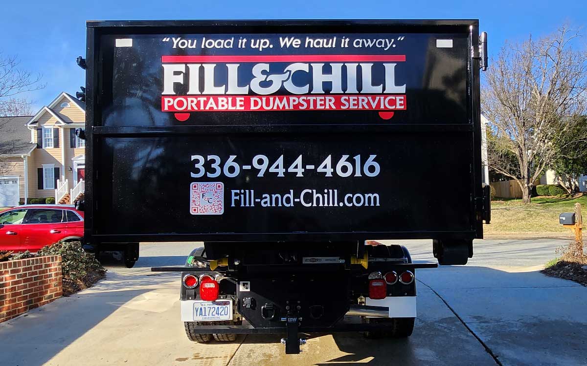 Filled Fill & Chill Dumpster Being Hauled Away